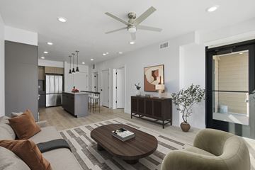 Millcreek apartment for rent - A modern living room with a brown coffee table and a brown couch.