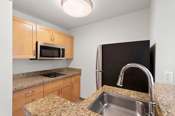 Kitchen with granite countertops and sink1