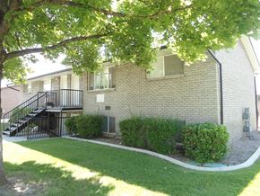 Orem apartment for rent - A house with a tree in front of it.