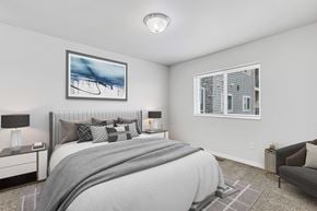 Rapid City apartment for rent - a bedroom with a large bed and two windows at Red Rock Apartments, Rapid City, SD, 57702