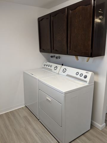 Orem apartment for rent - A white dishwasher and oven in a kitchen.