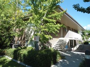 Orem apartment for rent - A building with a sign that says "Wi" in front of it.