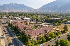 Orem apartment for rent - an aerial view of a neighborhood with mountains in the background at Siena Villas Apartments, Orem, Utah