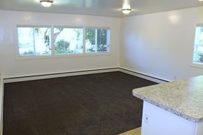 Provo apartment for rent - A room with a carpeted floor, a white counter, and a window with blinds.