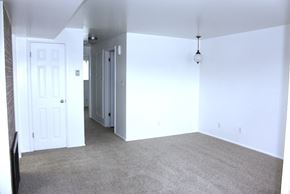 Orem apartment for rent - A room with a carpeted floor and white walls.
