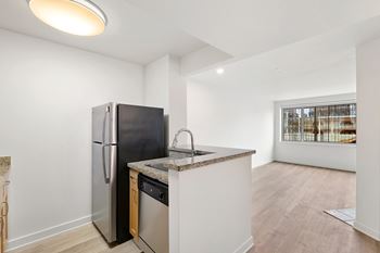 Kitchen with black fridge