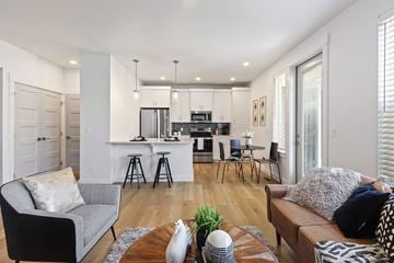 Boise townhouse for rent - a living room with a couch and a chair and a kitchen