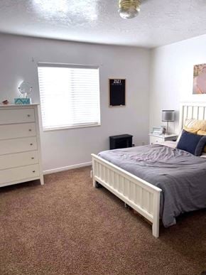Provo apartment for rent - A bedroom with a bed, dresser, and window.