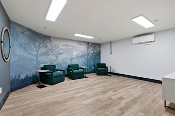 3 Green chairs in room