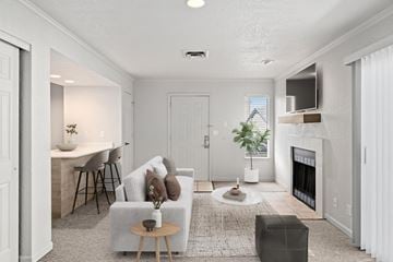 Overland Park apartment for rent - a living room with a couch and a fireplace
