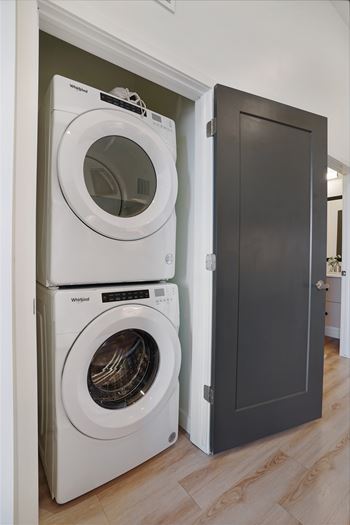White dryer and washer in laundry room