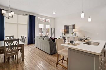 Provo apartment for rent - a living room with a kitchen and a dining table