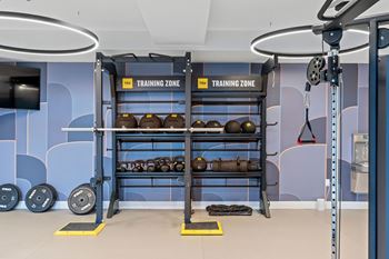 A gym with a training zone sign on the wall.