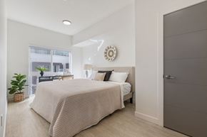 Salt Lake City apartment for rent - a bedroom with a bed and a window at Paperbox Lofts, Salt Lake City