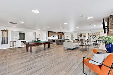 Rapid City apartment for rent - A living room with a pool table and a couch.