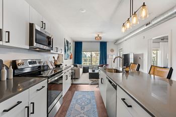 Open kitchen with island and view to living area