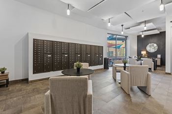 A conference room with a long table and chairs.