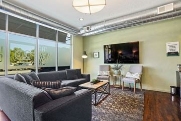Ogden apartment for rent - a living room with a couch and a television