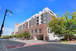 Salt Lake City apartment for rent - a large brick building with a garage in front of it at Wilmington Flats Apartments, Salt Lake City, UT, 84106