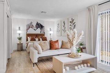 Jacksonville apartment for rent - a living room with a couch and a bed