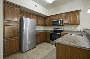 Orem apartment for rent - a kitchen with a refrigerator stove and microwave at Siena Villas Apartments, Orem, UT, 84097