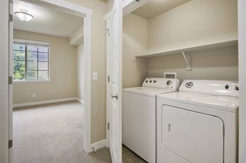 A laundry room with a washer and dryer.