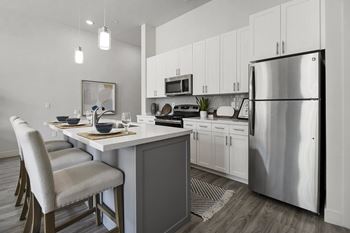 Kitchen with island and white chairs1