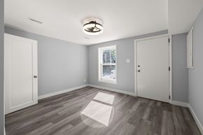 Kingston apartment for rent - A room with a window and a ceiling fan.