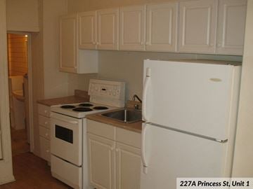 Kingston apartment for rent - a kitchen with a stove and a refrigerator