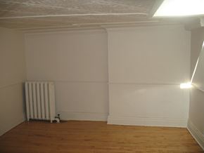 Kingston apartment for rent - an empty room with white walls and a radiator