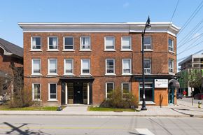 Kingston apartment for rent - A red brick building with a black awning and a sign that says "Blackberry".