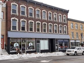 Gananoque apartment for rent - a building with a car parked in front of it
