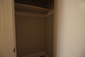 Kingston apartment for rent - a room with a closet and an open door