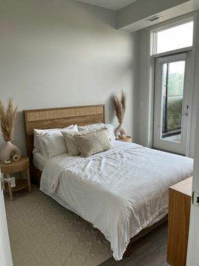 Calgary apartment for rent - a bedroom with a bed and a window