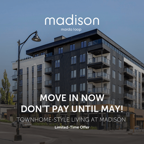 Calgary apartment for rent - A modern apartment building with a sign advertising a move-in offer.