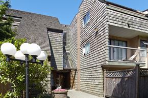 Surrey apartment for rent - a house with a gray shingle roof