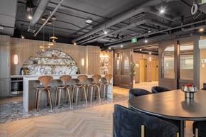 Calgary apartment for rent - A modern dining area with a round table and chairs.