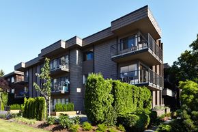 North Vancouver apartment for rent - a picture of an apartment building with a blue sky in the background