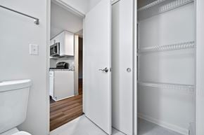 Lombard apartment for rent - A white refrigerator is in a kitchen with a white toilet.