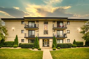 Darien apartment for rent - A modern apartment building with a balcony on each floor.