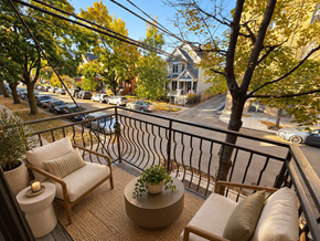 Chicago apartment for rent - A balcony with a chair, table and potted plant.