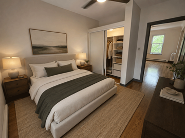 Chicago apartment for rent - A bedroom with a large bed and a painting on the wall.