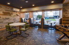 Chicago apartment for rent - A room with a table and chairs and a pool table at The Bryn - 5600 N Sheridan Rd Apartments, Chicago, IL, 60660