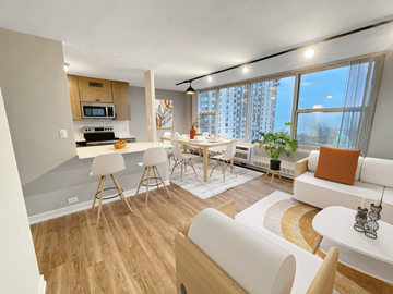 Chicago apartment for rent - a living room and kitchen with a table and chairs