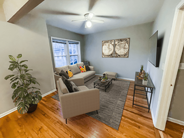 Chicago apartment for rent - a living room with furniture and a ceiling fan