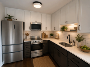 Chicago apartment for rent - A modern kitchen with a stainless steel refrigerator, microwave, oven, and sink.