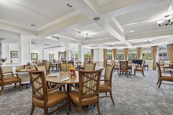 Large room with a dining table and chairs