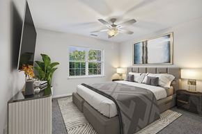 Glenmont apartment for rent - Bright bedroom with ceiling fan and gray decor at Glenmont Abbey Village Apartments, New York