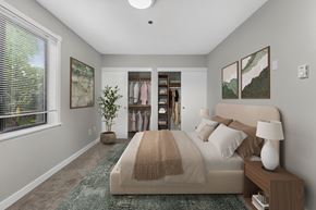 King City apartment for rent - A bedroom with a large bed and a window with blinds.