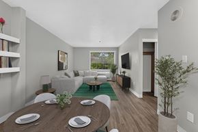 King City apartment for rent - A dining room with a wooden table set for two.